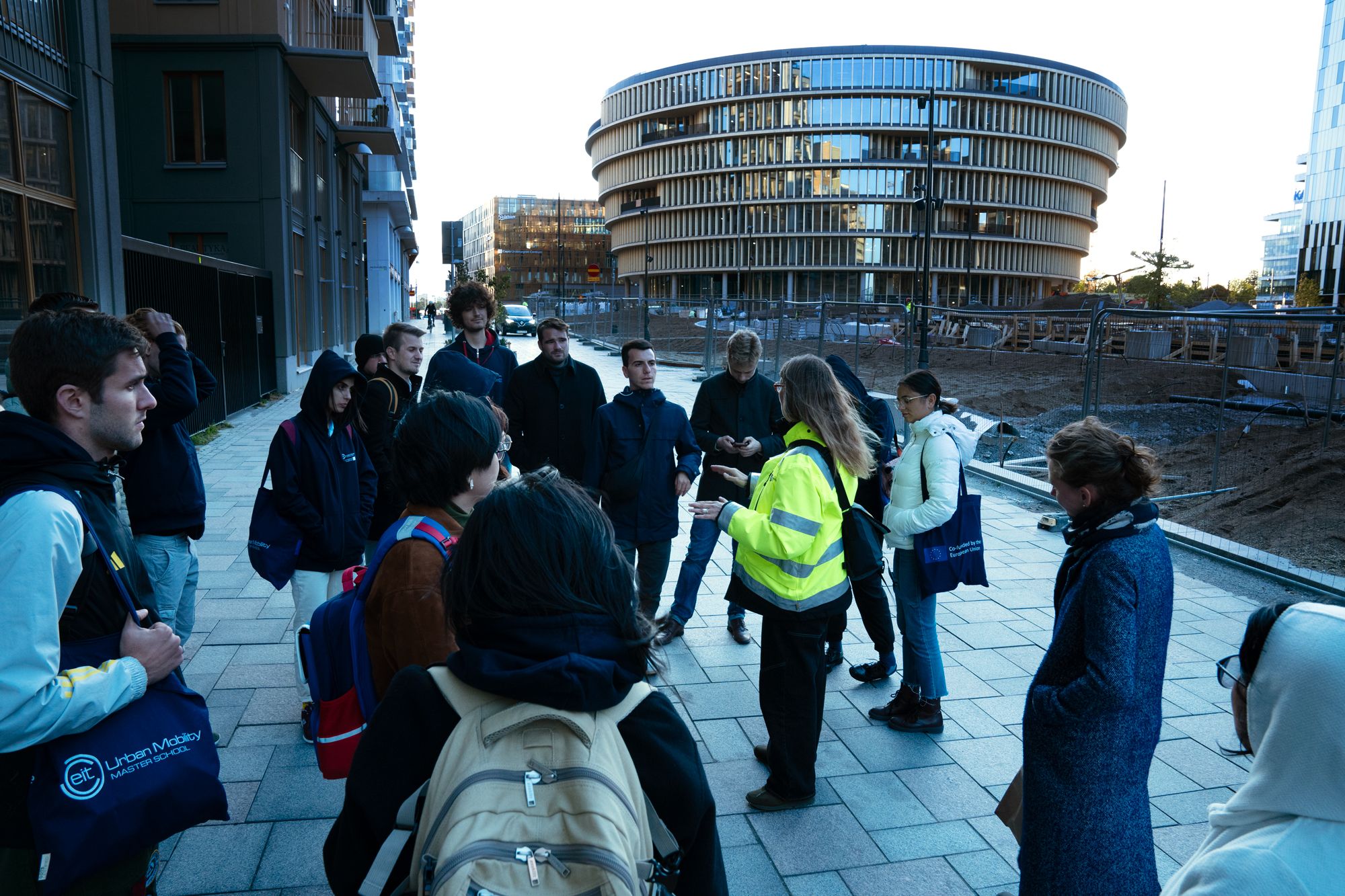 a group of students in front of a construction site